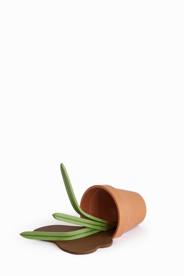 Wooden plant sculpture toppled over
