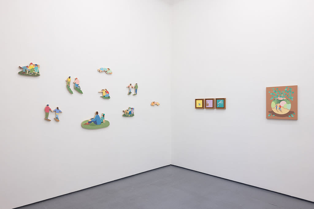 White gallery wall with various pieces by Danym Kwon including paintings and small wooden sculptures