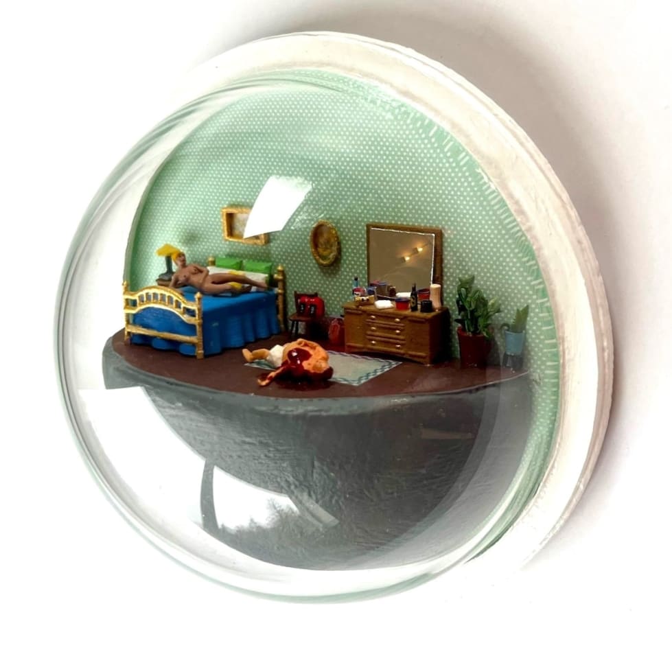 sculpture in glass case