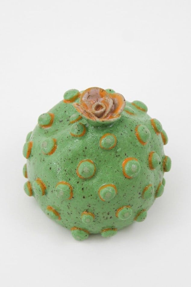 Jen Dwyer sculpture - round green plant with pink flower on top