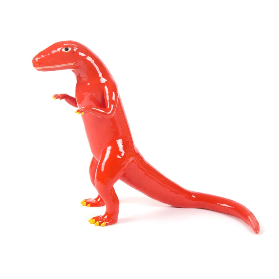 red ceramic sculpture of a prehistoric lizard standing upright