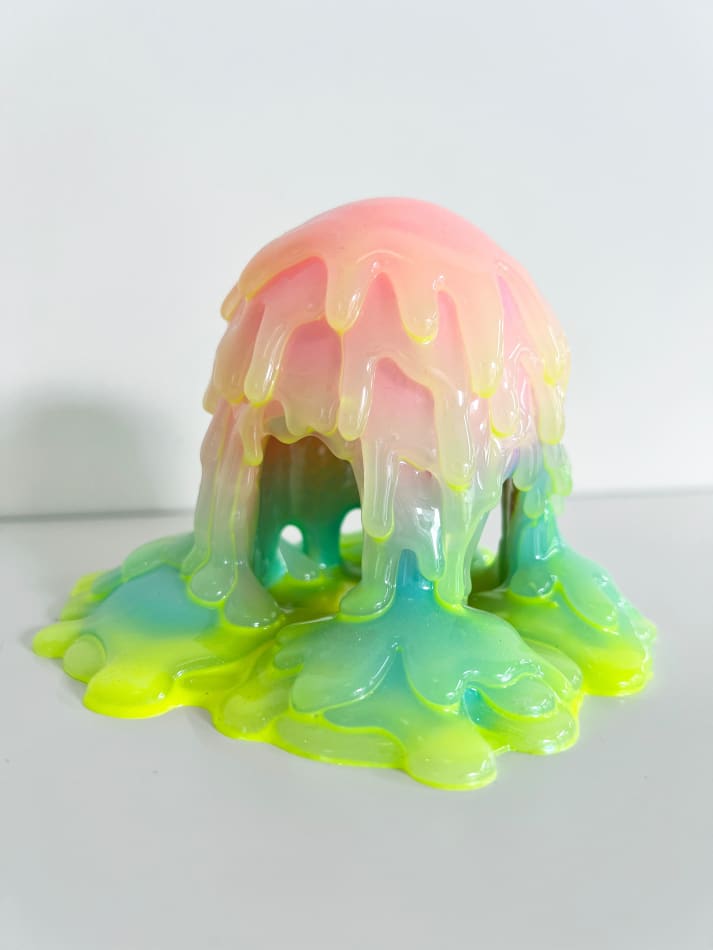 Dripping sculpture with rainbow gradient and neon green coating by Dan Lam