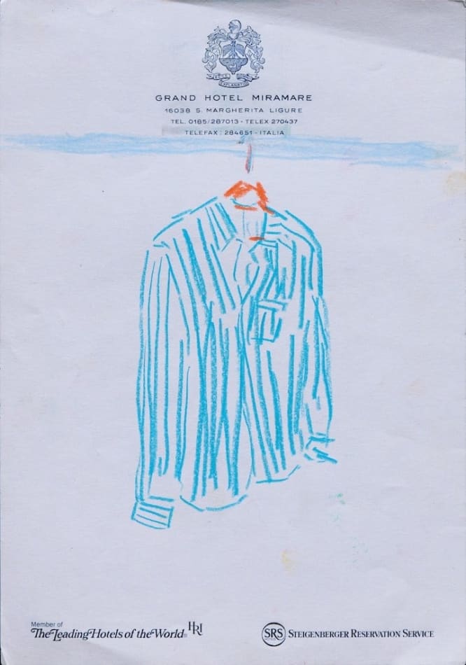 sketch of blue button down shirt on a hanger on hotel stationary