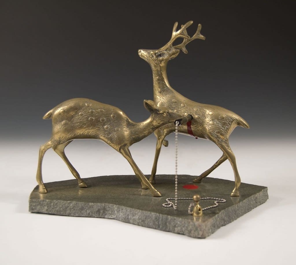 Jeremiah Jenkins sculpture of deers with pen