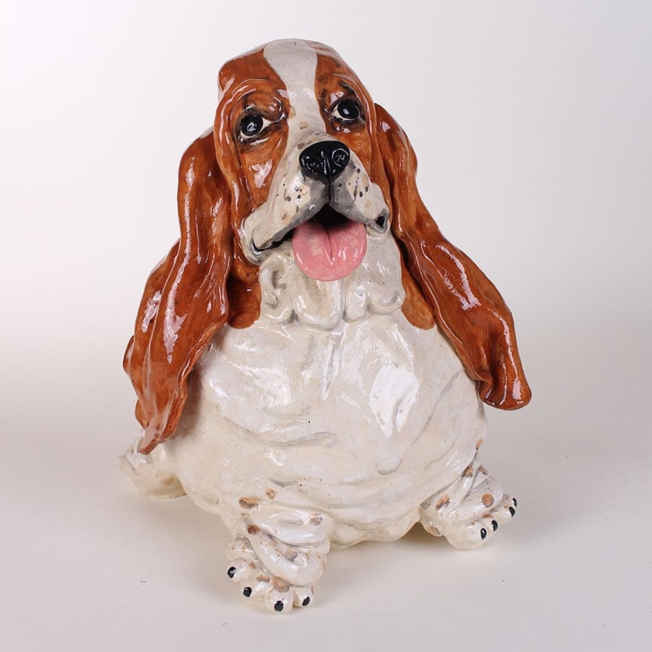 Katie Kimmel - ceramic sculpture of a brown and white basset hound, its body is rounded like a balloon