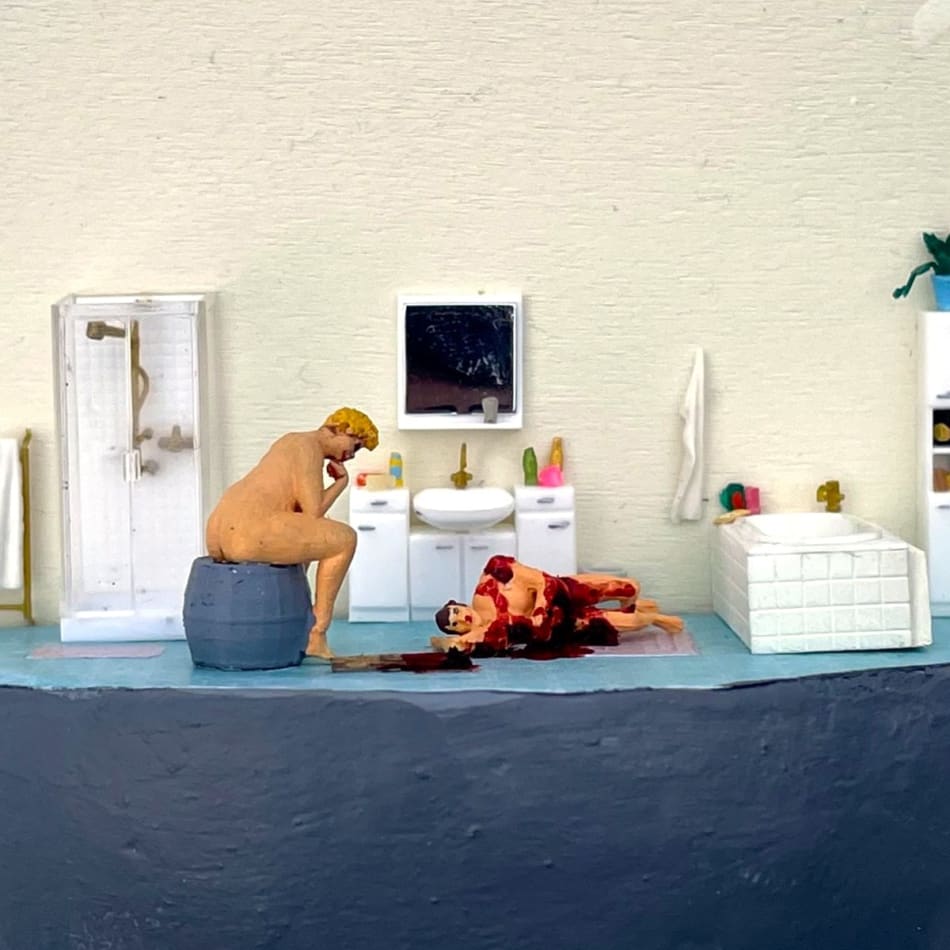 nude seated person looking over a bloody corpse