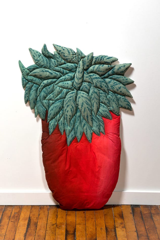 soft sculpture of a bushy green plant in a red pot