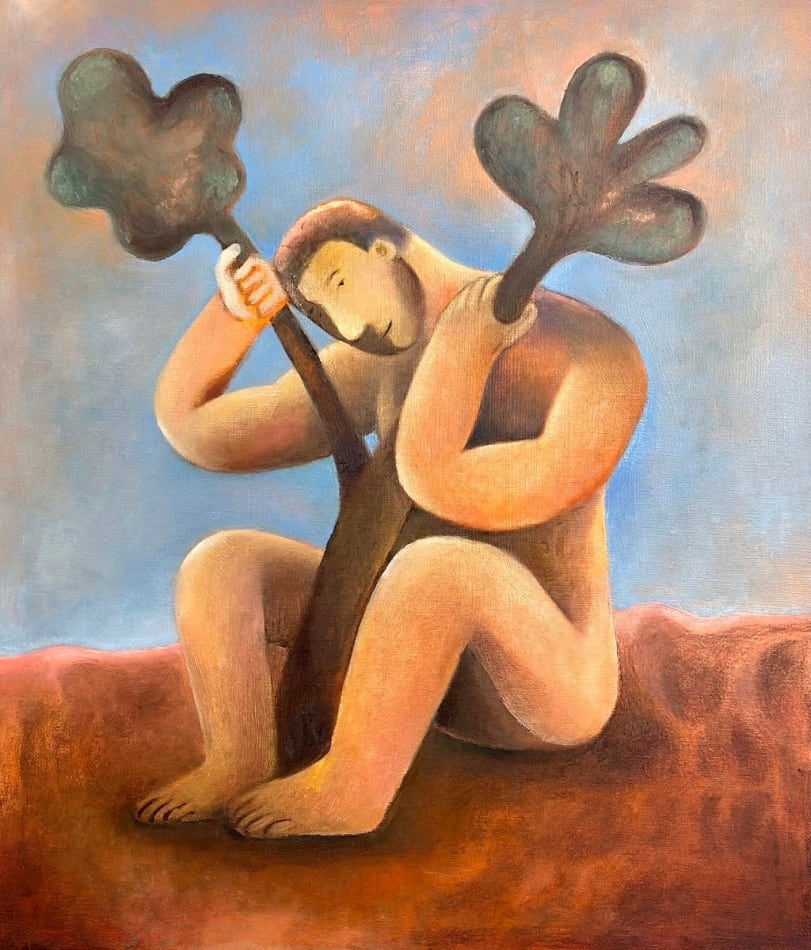 Carlos Rodriguez - painting of a nude man sitting on the floor with his knees bended. He holds a branch in between him. The branch split on the top and the man placed his head in between it. The background was painted blue.
