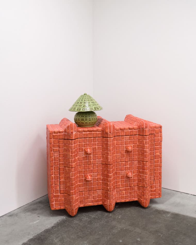 lamp made out of green smiley face ceramic tiles by artist Kyle Daniels