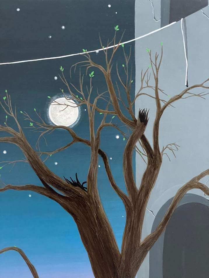 detail shot of the moon and tree branches
