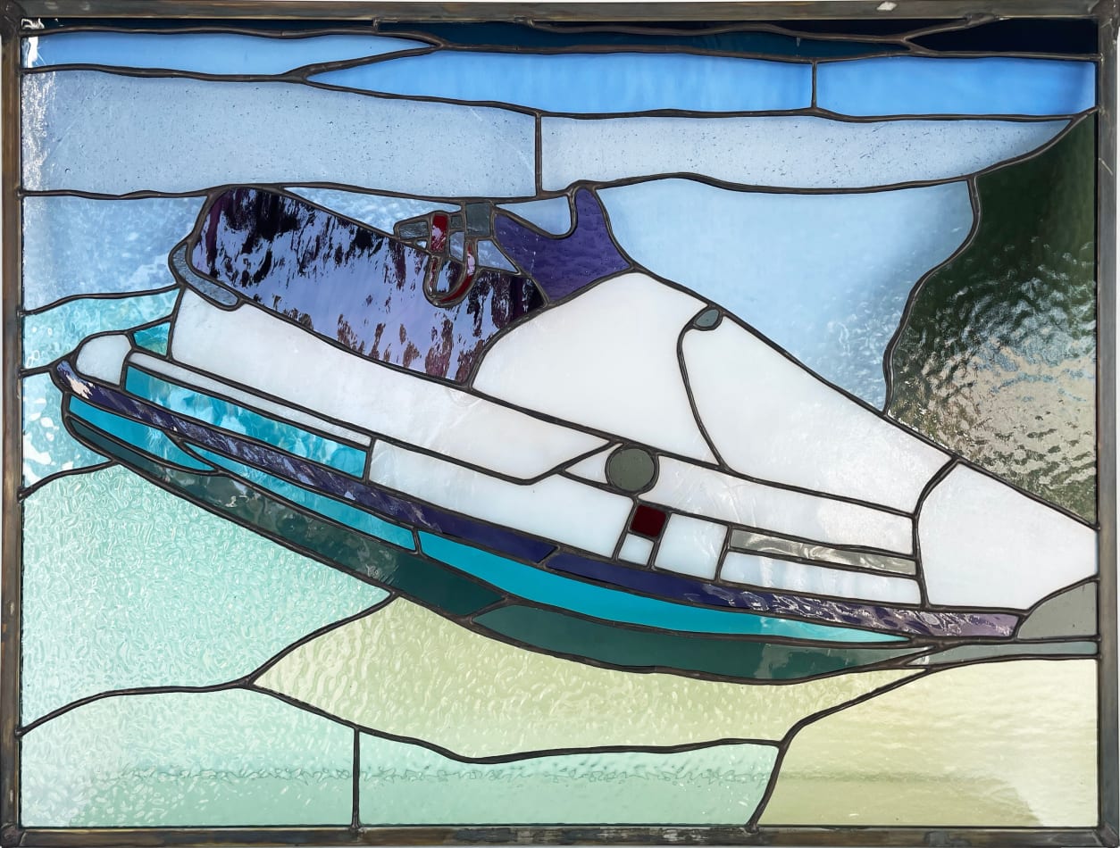 Pat Perry and Rosemary Brown collaborative stainglass piece of a water ski