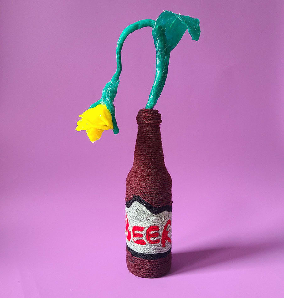 Allison Baker's sculpture of a yellow flower in a beer bottle