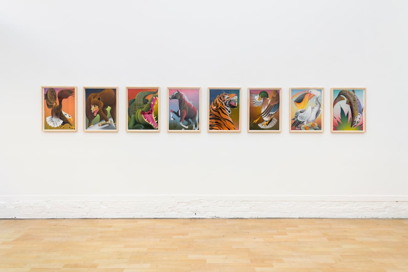 photo of 8 casey gray animal paintings hung on the gallery wall