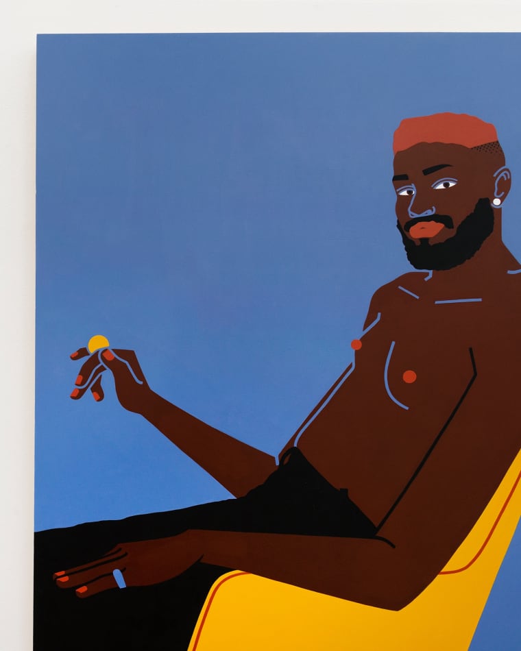 Man with red hair sitting in yellow chair holding a coin by Jillian Evelyn