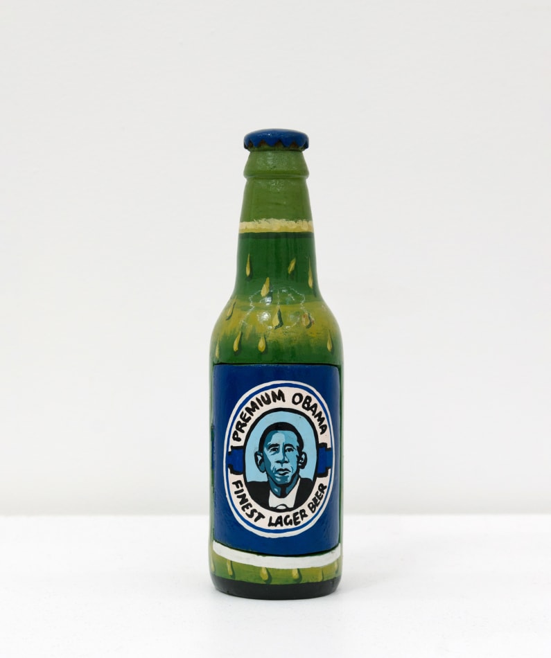 Paa Joe's sculpture of a beer bottle with Obama on it