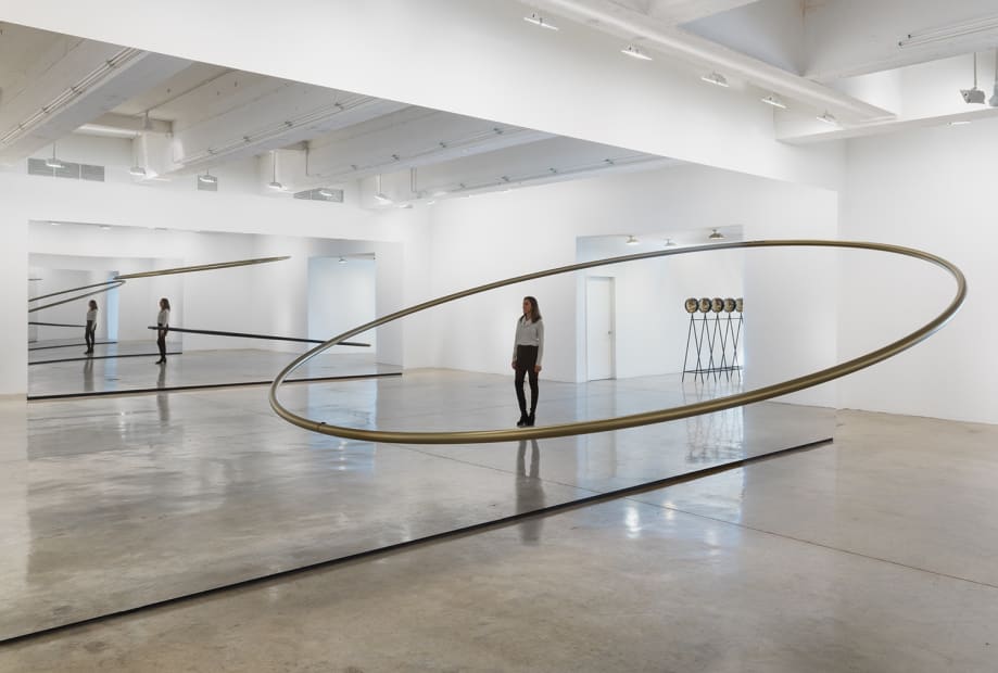 Image of Eliasson, mirrored panels reflecting circular sculptures