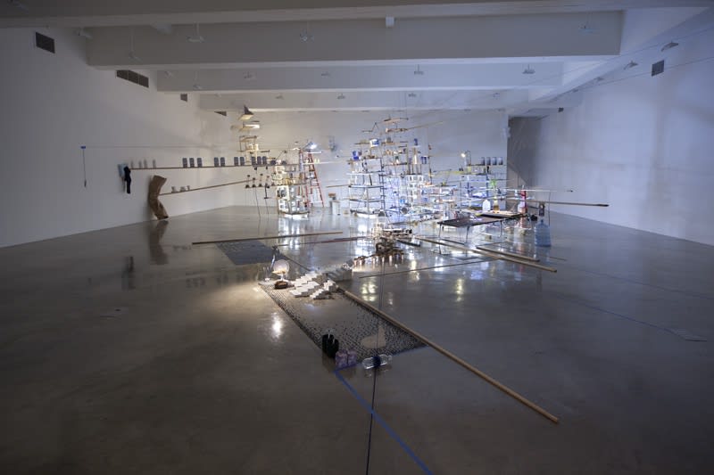 sarah sze installation view of large structure with dimmed lights