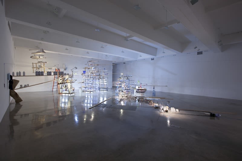 sarah sze installation view of large structure with dimmed lights