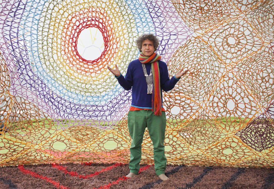 Ernesto inside the Ernesto Neto crochet installation