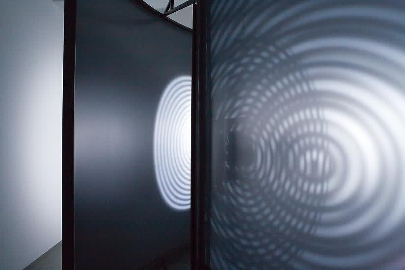 Eliasson dark room with shadows turning disc
