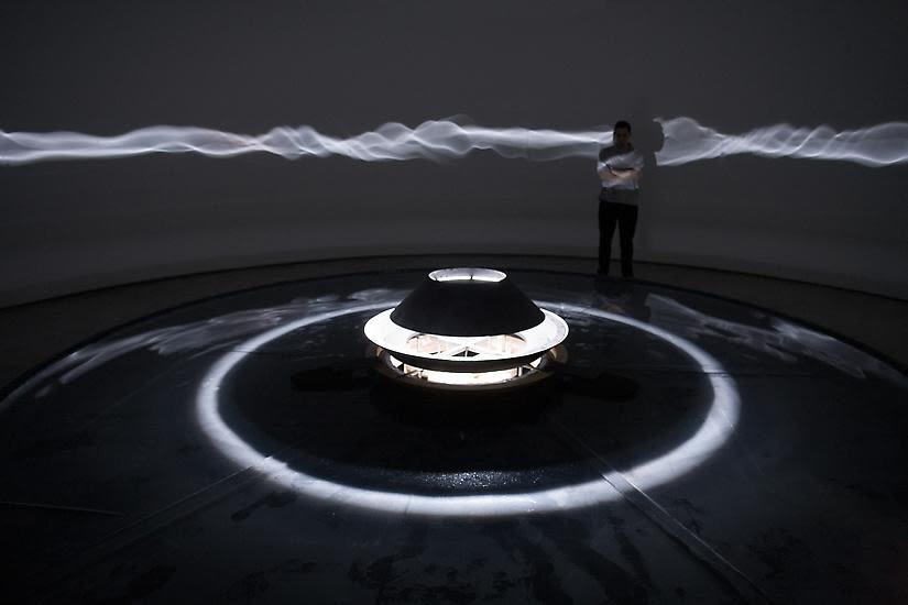 Eliasson dark room installation with light wave