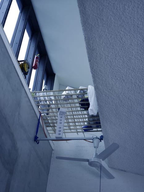 Image of a multi-story installation with ladders and objects
