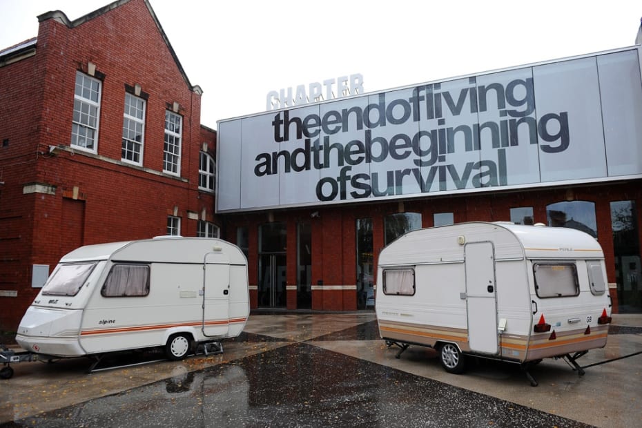 Image of Phil collins installation of trailers outside of museum