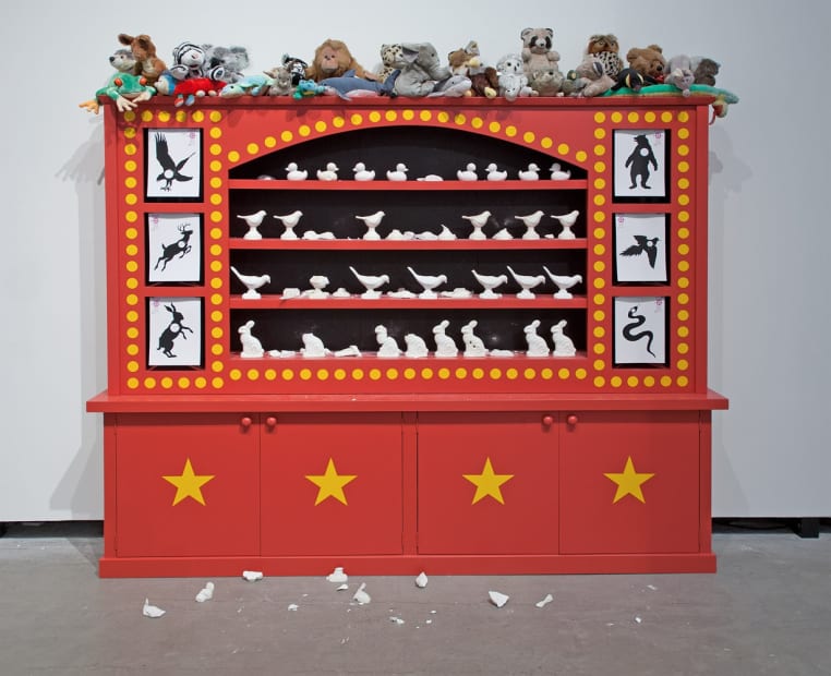 Image of Mark Dion exhibition, large cabinet with animals on top