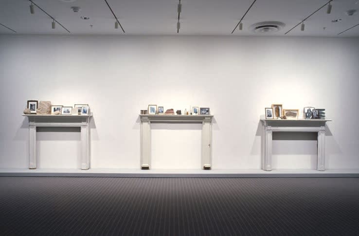 image of installation with cabinet and sculptures at MoMA