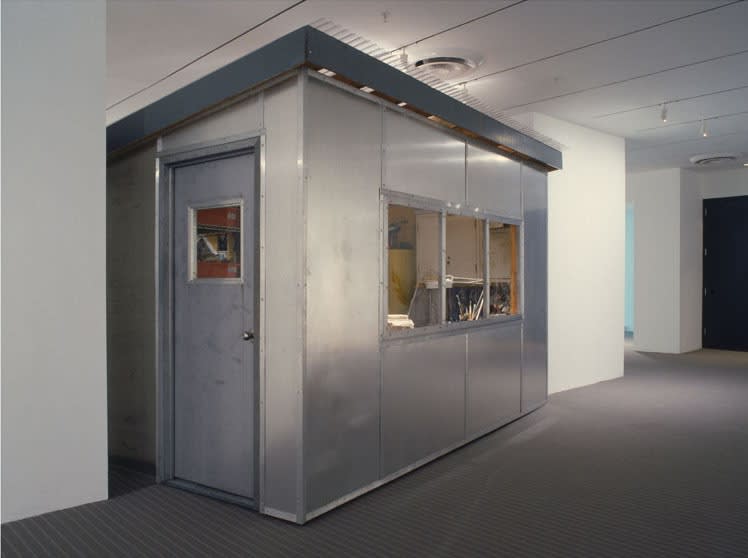 image of installation with cabinet and sculptures at MoMA