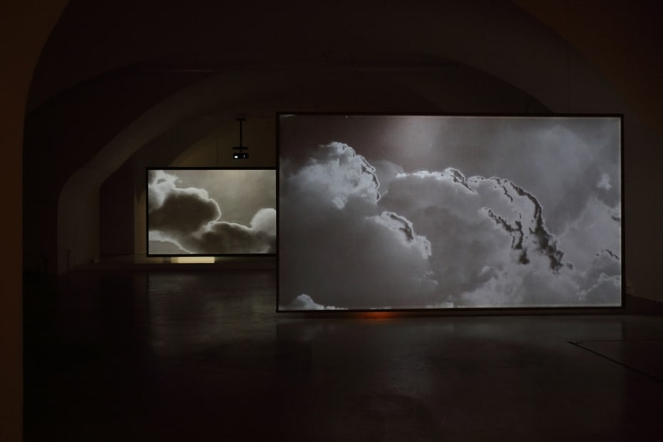 Installation image of Lisa Oppenheim cloud projections