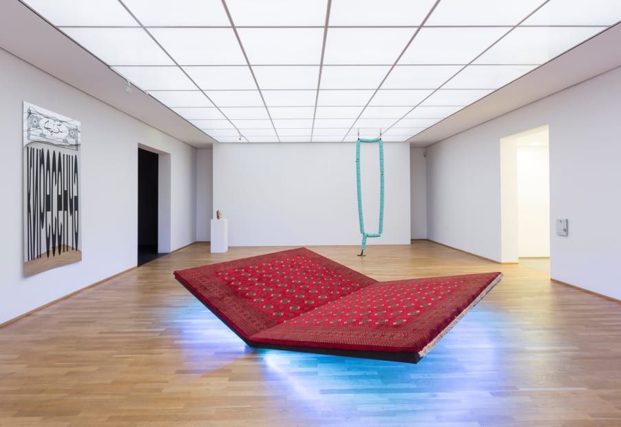 Image of installation view of Slavs and Tatars, carpet bench and pray sway swing
