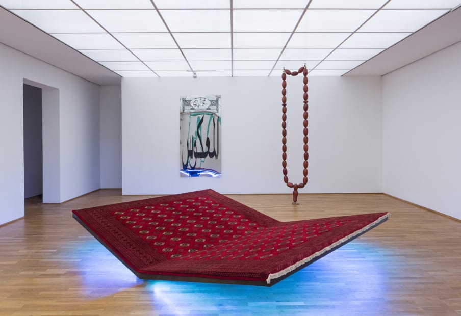 Image of installation view of Slavs and Tatars, carpet bench and pray sway swing