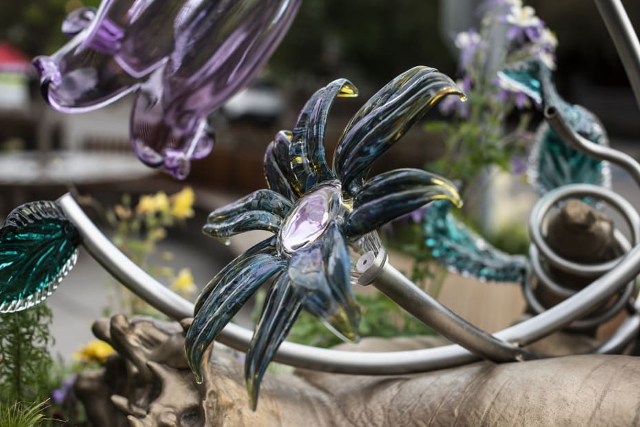 Image of Kelly Akashi bronze hand sculpture with glass flowers
