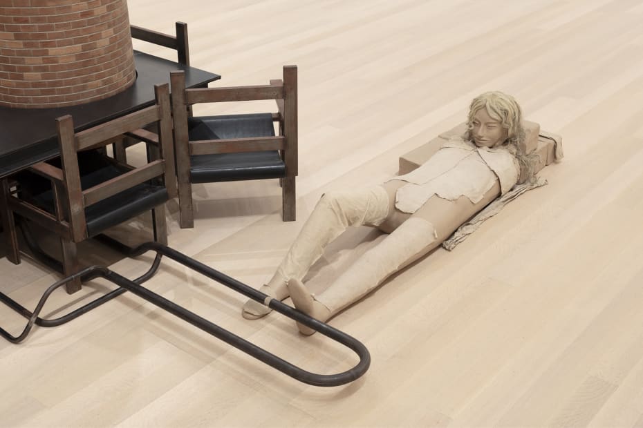 Image of Mark Manders installation, factory with clay figure and chair