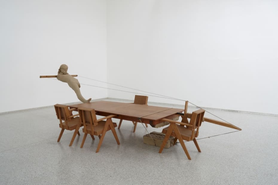 image of Mark Manders tables and chairs with clay figure at Venice Biennale