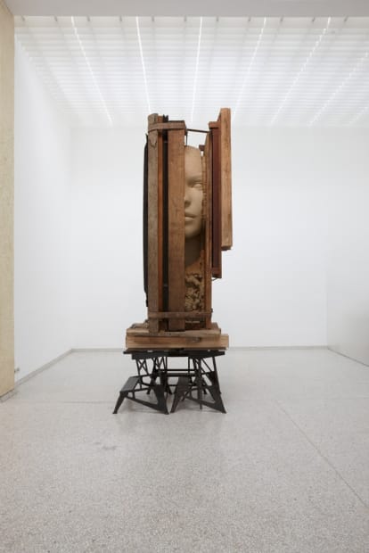 image of Mark Manders head sculpture with wood at Venice Biennale