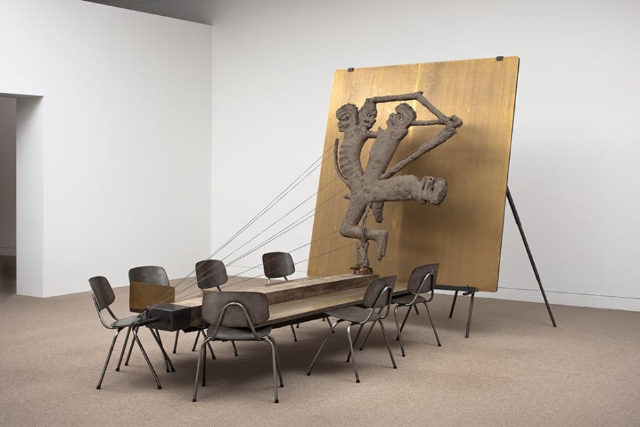 Image of Mark Manders sculpture table with gold wall and figure