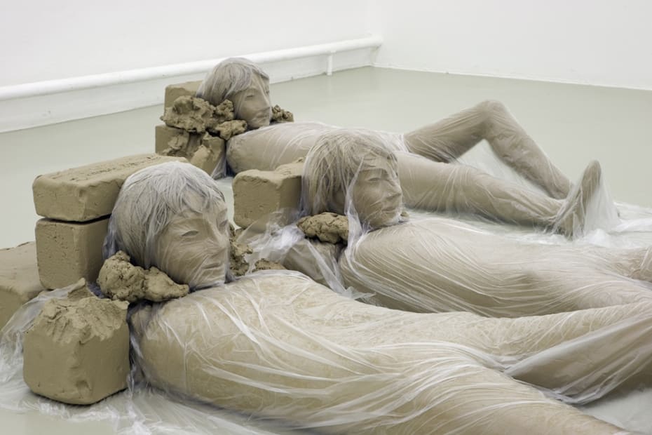 image of Mark Manders clay figures on floor with plastic
