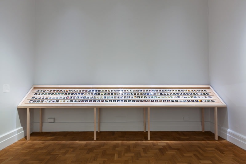 Installation view of Gillian Wearing at National Portrait Gallery, polaroids in vitrine