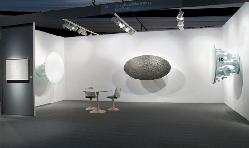 image of installation of ADAA booth 3 table-like works by Charles Long mounted on the wall