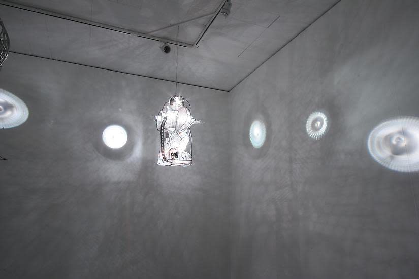 image of installation image of multiple Charles Long white sculptures, dim lighting and shadows