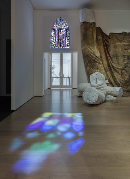 image Charles Long sculptural installation in darkened gallery space, faux stained glass window