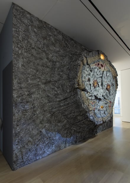 image Charles Long sculptural installation in darkened gallery space, large stump relief