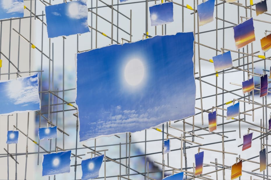 image of large Sarah Sze installation - small photos of the sun arranged in a sphere