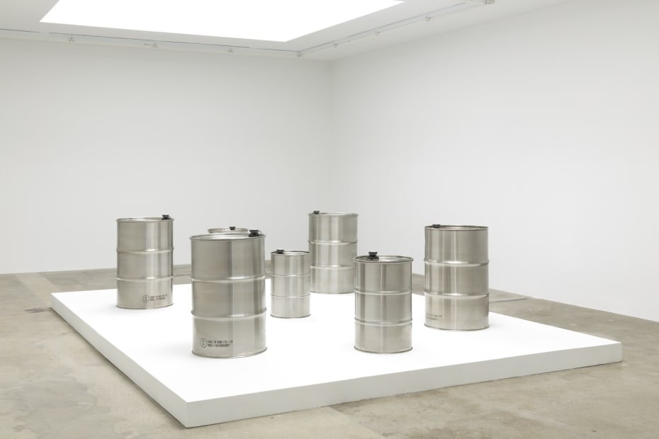 image of steel barrels on white pedestal
