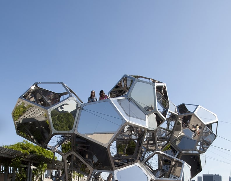 image of cloud cities installation on the Met rooftop, with people interacting with it