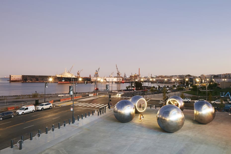 image of 5 large steel spheres with truncated mirror