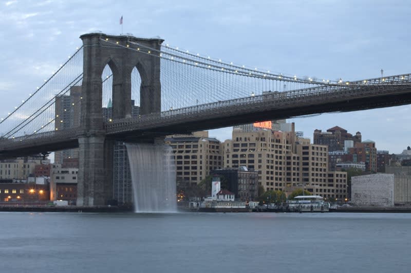 image of waterfall underneath Brooklyn Bridge