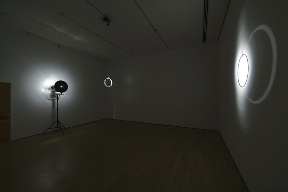 dark room with light and rotating objects